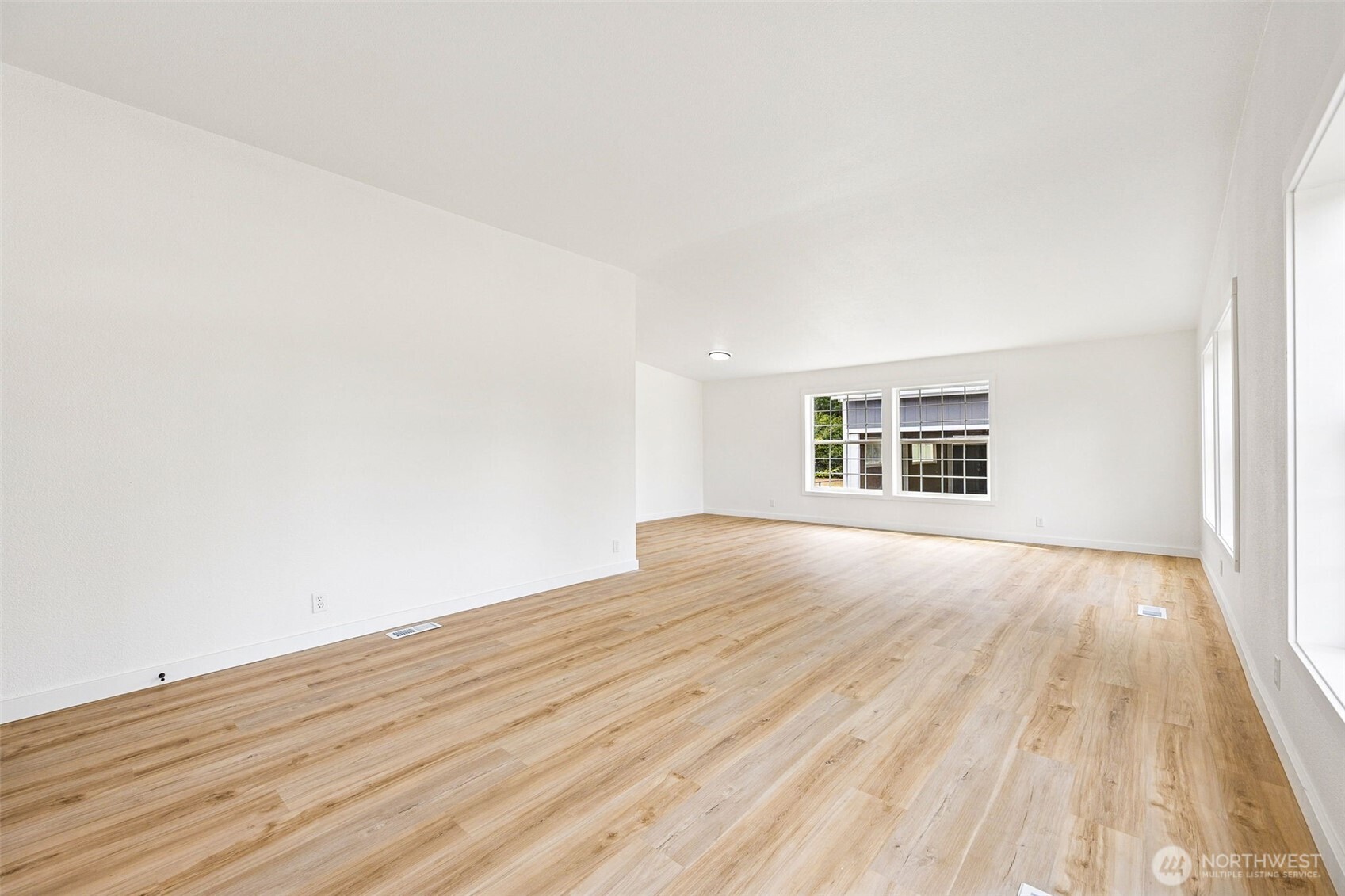 125 Highland Road Winlock, WA 98596 - Photo 6 of 40 wooden floor in an empty room with a window
