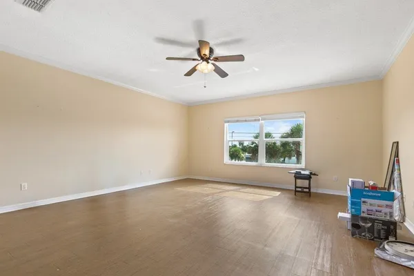 a kitchen with stainless steel appliances granite countertop a refrigerator a stove a sink and a microwave