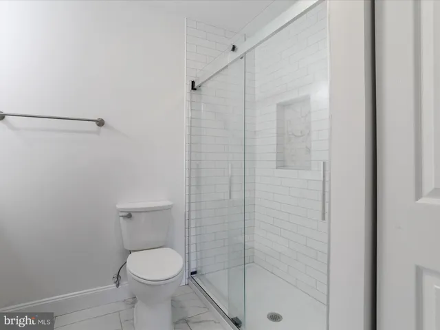 a house that has a tree in front of it