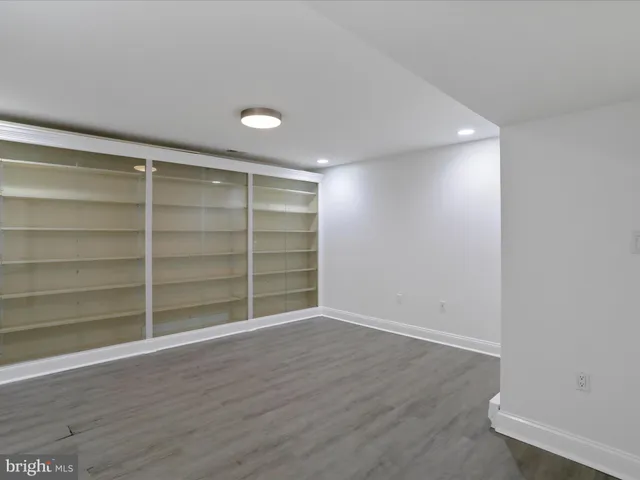 a view of a dining room with furniture wooden floor and a chandelier
