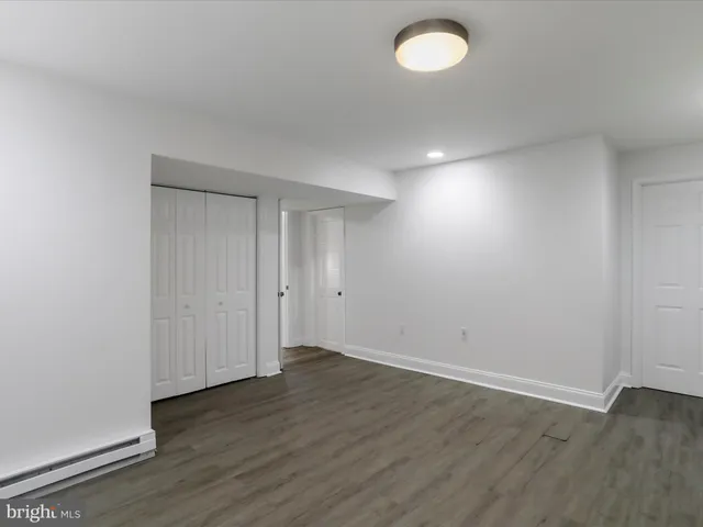 a view of a dining room with furniture wooden floor and a chandelier