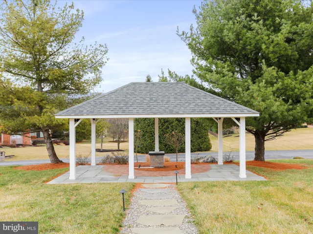 a kitchen with stainless steel appliances granite countertop a sink and a refrigerator