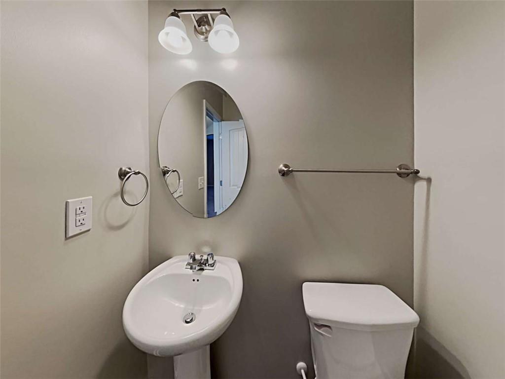 3144 Broadleaf Trail Road Fairburn, GA 30213 - Photo 12 of 21 a bathroom with a toilet sink and mirror