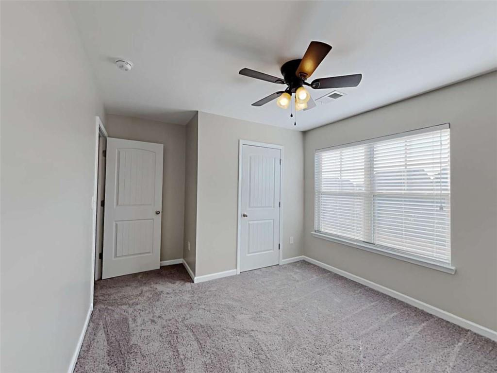 3144 Broadleaf Trail Road Fairburn, GA 30213 - Photo 13 of 21 a view of an empty room with a window