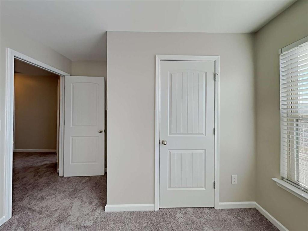 3144 Broadleaf Trail Road Fairburn, GA 30213 - Photo 15 of 21 a view of an empty room with windows and closet