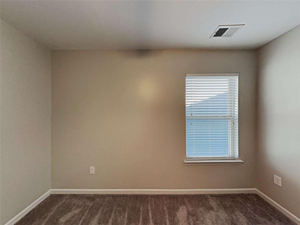 3144 Broadleaf Trail Road Fairburn, GA 30213 - Photo 18 of 21 an empty room with a window