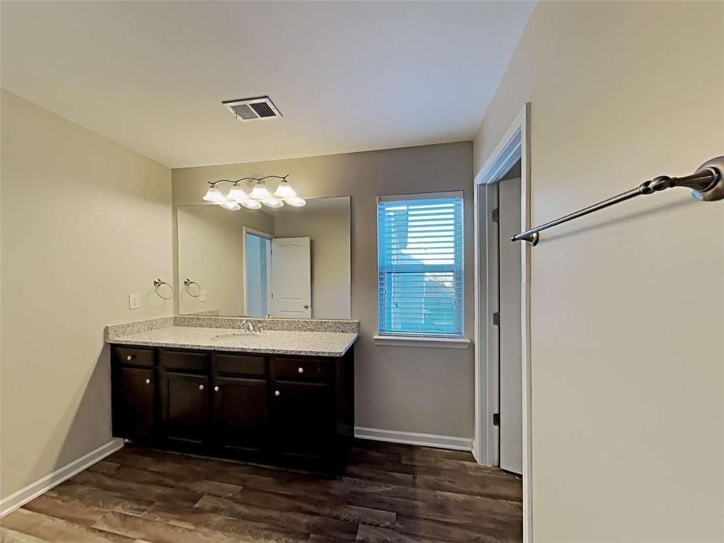 3144 Broadleaf Trail Road Fairburn, GA 30213 - Photo 21 of 21 a room with a sink and chandelier