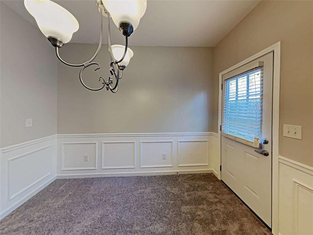 3144 Broadleaf Trail Road Fairburn, GA 30213 - Photo 5 of 21 a view of a room with rack on the wall