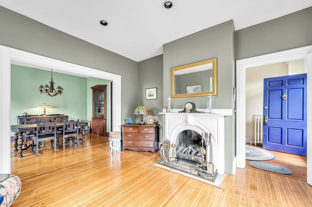 33 Madison Avenue Springfield, MA 01105 - Photo 3 of 32 a living room with furniture a fireplace and a table