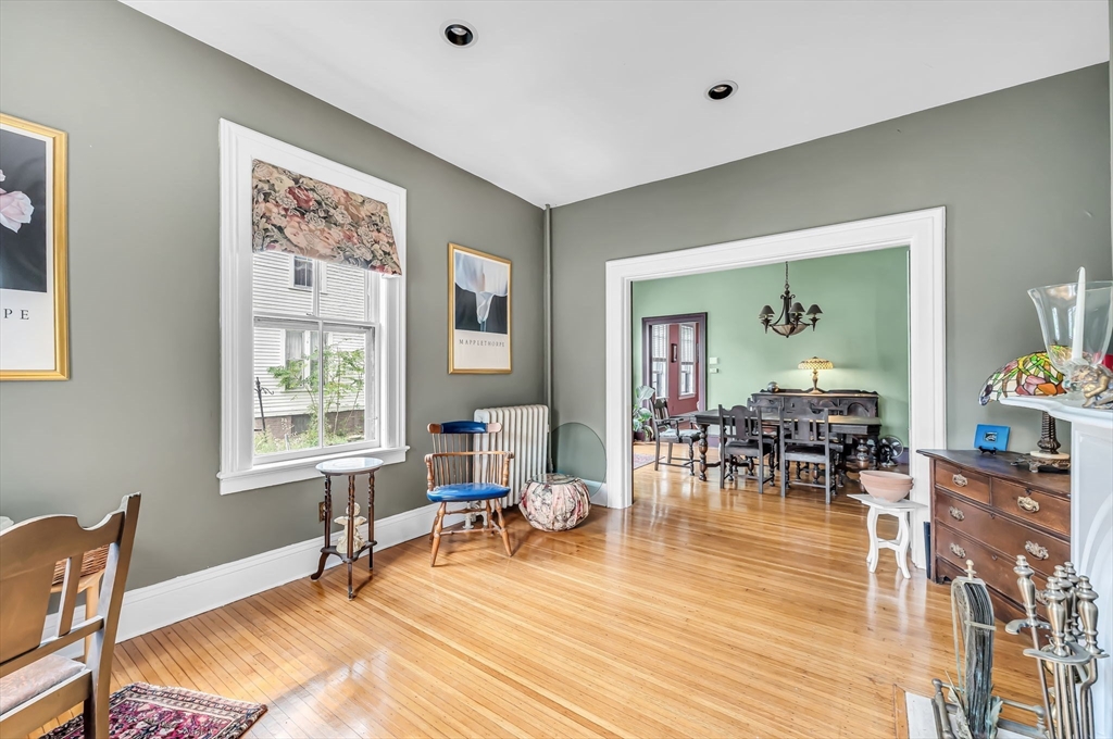 33 Madison Avenue Springfield, MA 01105 - Photo 5 of 32 a living room with furniture a wooden floor and a window