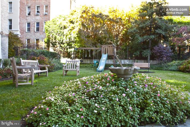 2022 Columbia Road Northwest, Unit 107 Washington, DC 20009 - Photo 41 of 47 Building back yard with seating and flowers