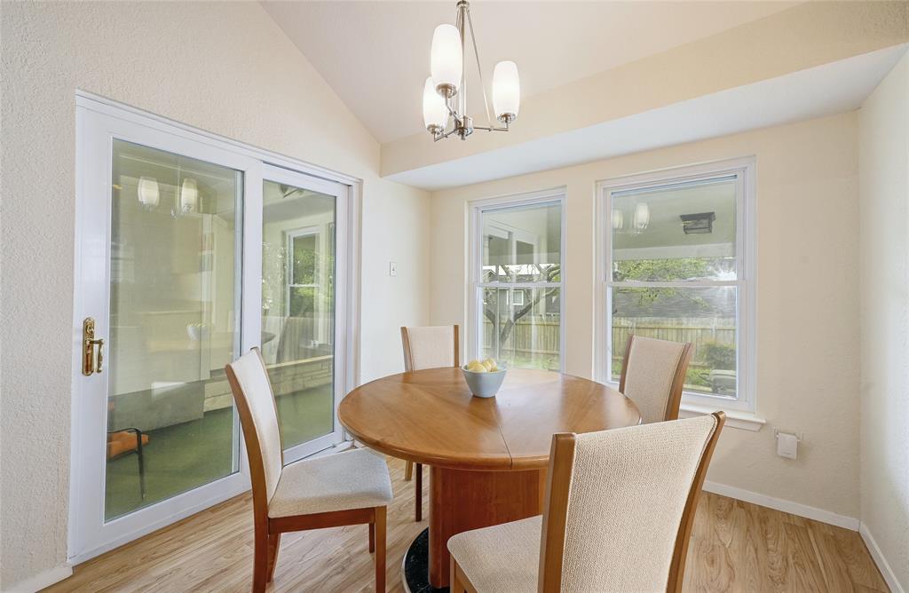 8507 Selway Drive Austin, TX 78736 - Photo 12 of 22 a view of a dining room with furniture window and wooden floor