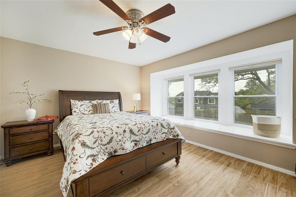 8507 Selway Drive Austin, TX 78736 - Photo 14 of 22 a bedroom with a large bed and a large window