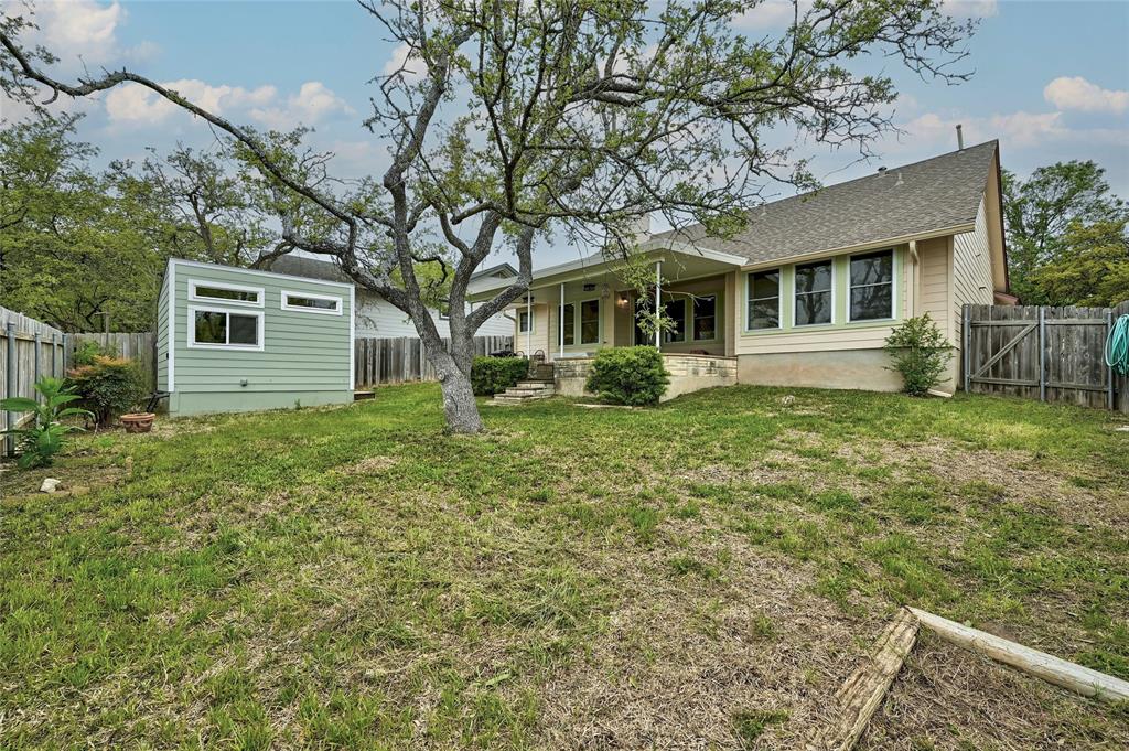 8507 Selway Drive Austin, TX 78736 - Photo 17 of 22 a front view of a house with a garden