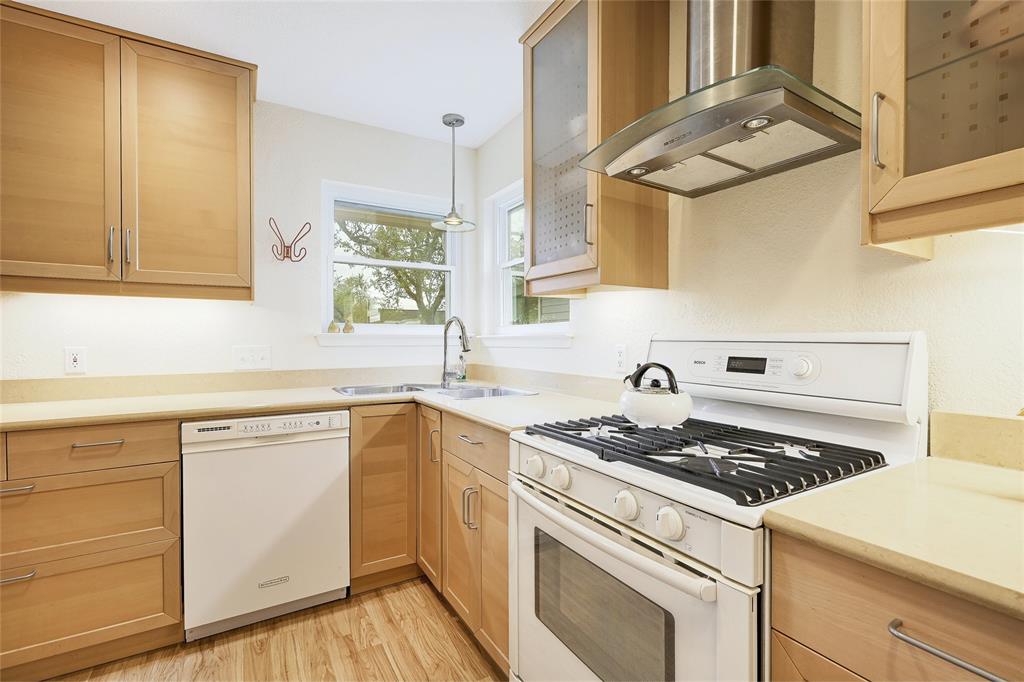 8507 Selway Drive Austin, TX 78736 - Photo 19 of 22 a kitchen with cabinets appliances and a window