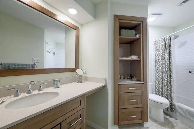 a bathroom with a sink double vanity and a shower