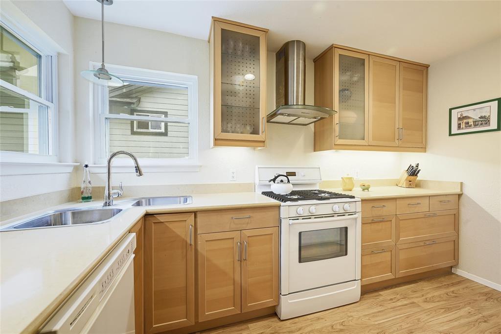 8507 Selway Drive Austin, TX 78736 - Photo 10 of 22 a view of a sink and dishwasher with wooden floor