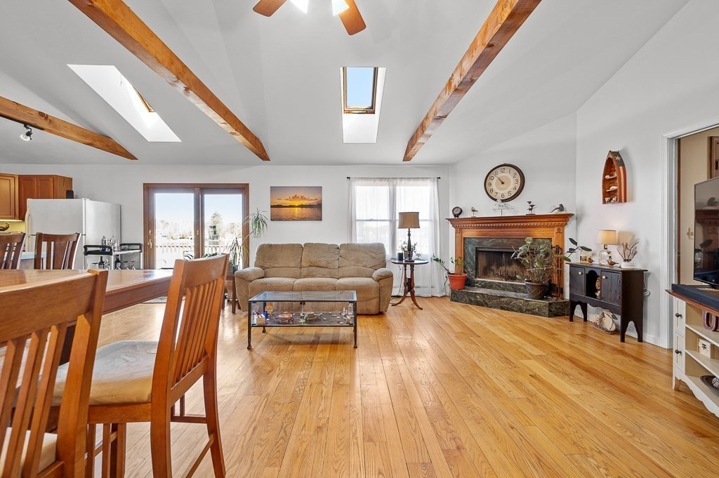 25 Bates Grove Road Webster, MA 01570 - Photo 15 of 42 a living room with furniture a fireplace and a flat screen tv