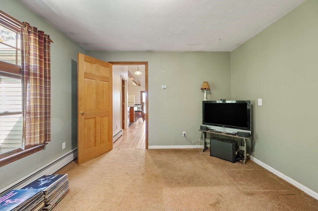 25 Bates Grove Road Webster, MA 01570 - Photo 22 of 42 a view of work space with wooden floor and a window