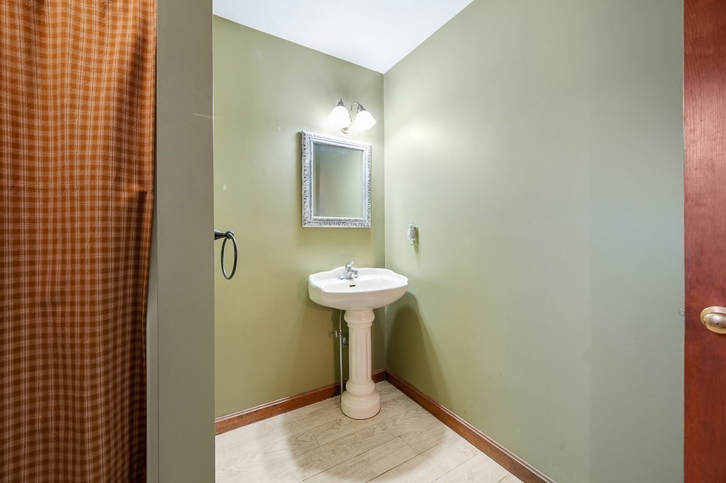 25 Bates Grove Road Webster, MA 01570 - Photo 24 of 42 a bathroom with a sink and a mirror