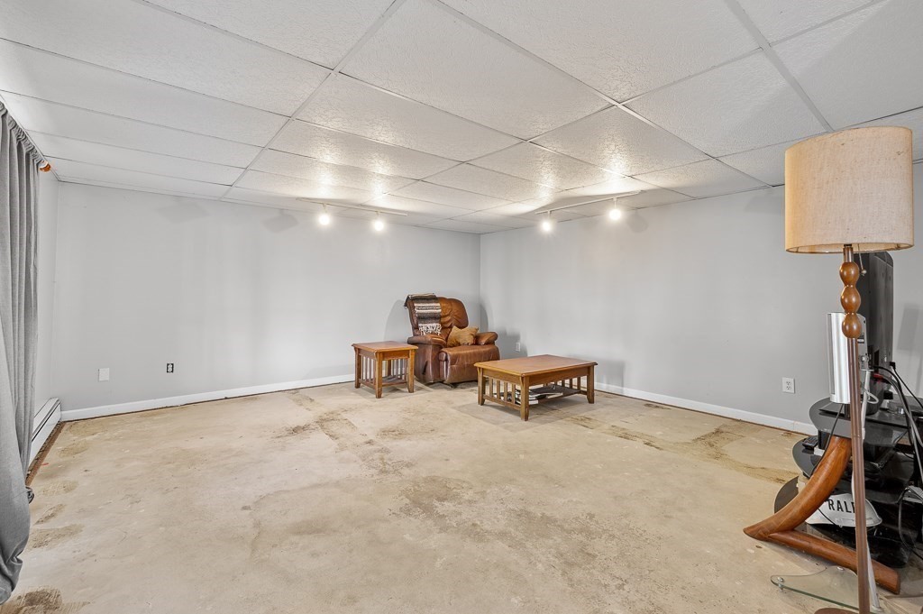 25 Bates Grove Road Webster, MA 01570 - Photo 25 of 42 a view of a room with gym equipment