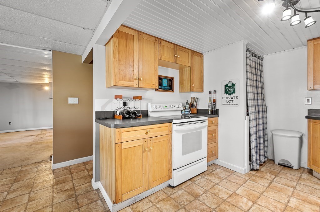 25 Bates Grove Road Webster, MA 01570 - Photo 29 of 42 a kitchen with stainless steel appliances granite countertop a refrigerator and a stove