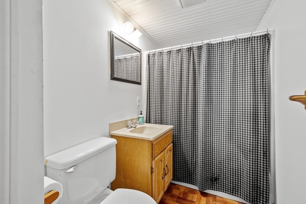 25 Bates Grove Road Webster, MA 01570 - Photo 32 of 42 a bathroom with a sink toilet and mirror