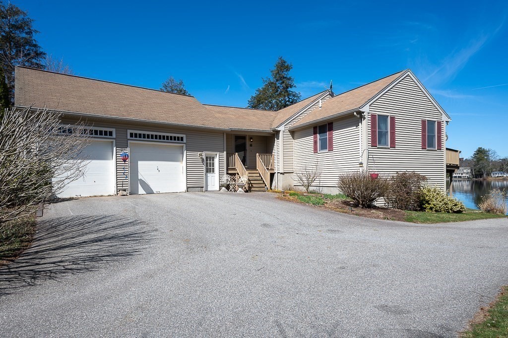 25 Bates Grove Road Webster, MA 01570 - Photo 4 of 42 a view of a house with a yard