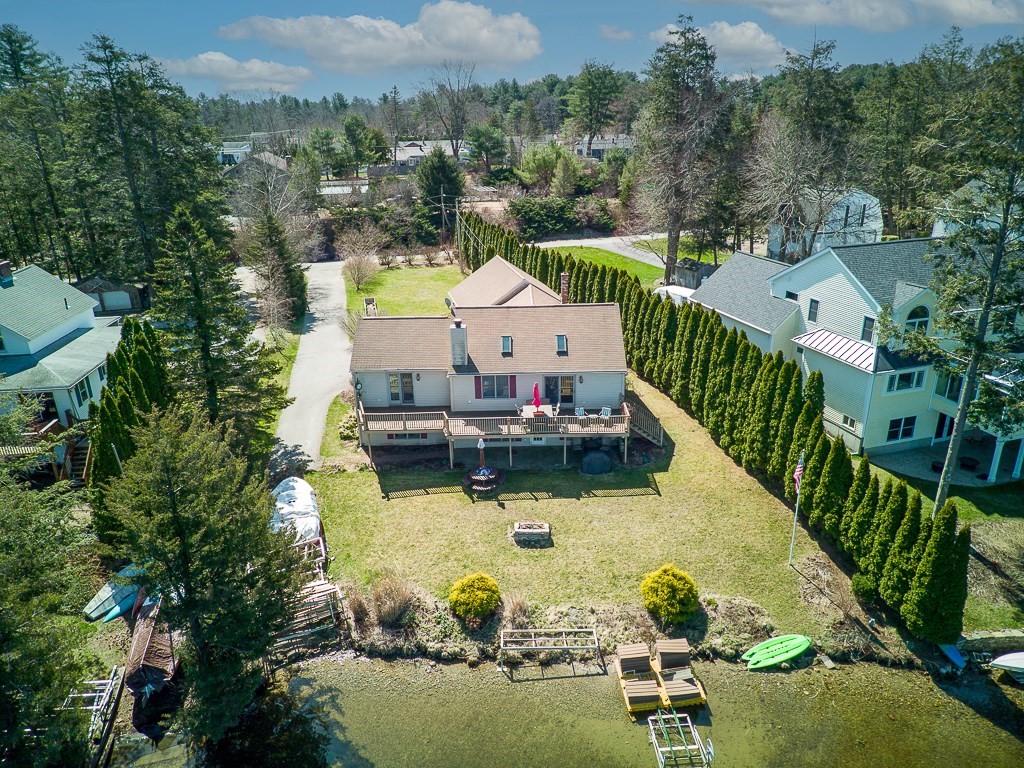 25 Bates Grove Road Webster, MA 01570 - Photo 41 of 42 an aerial view of a house with swimming pool patio and lake view
