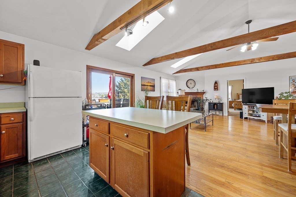 25 Bates Grove Road Webster, MA 01570 - Photo 10 of 42 a kitchen with stainless steel appliances granite countertop a sink and a refrigerator