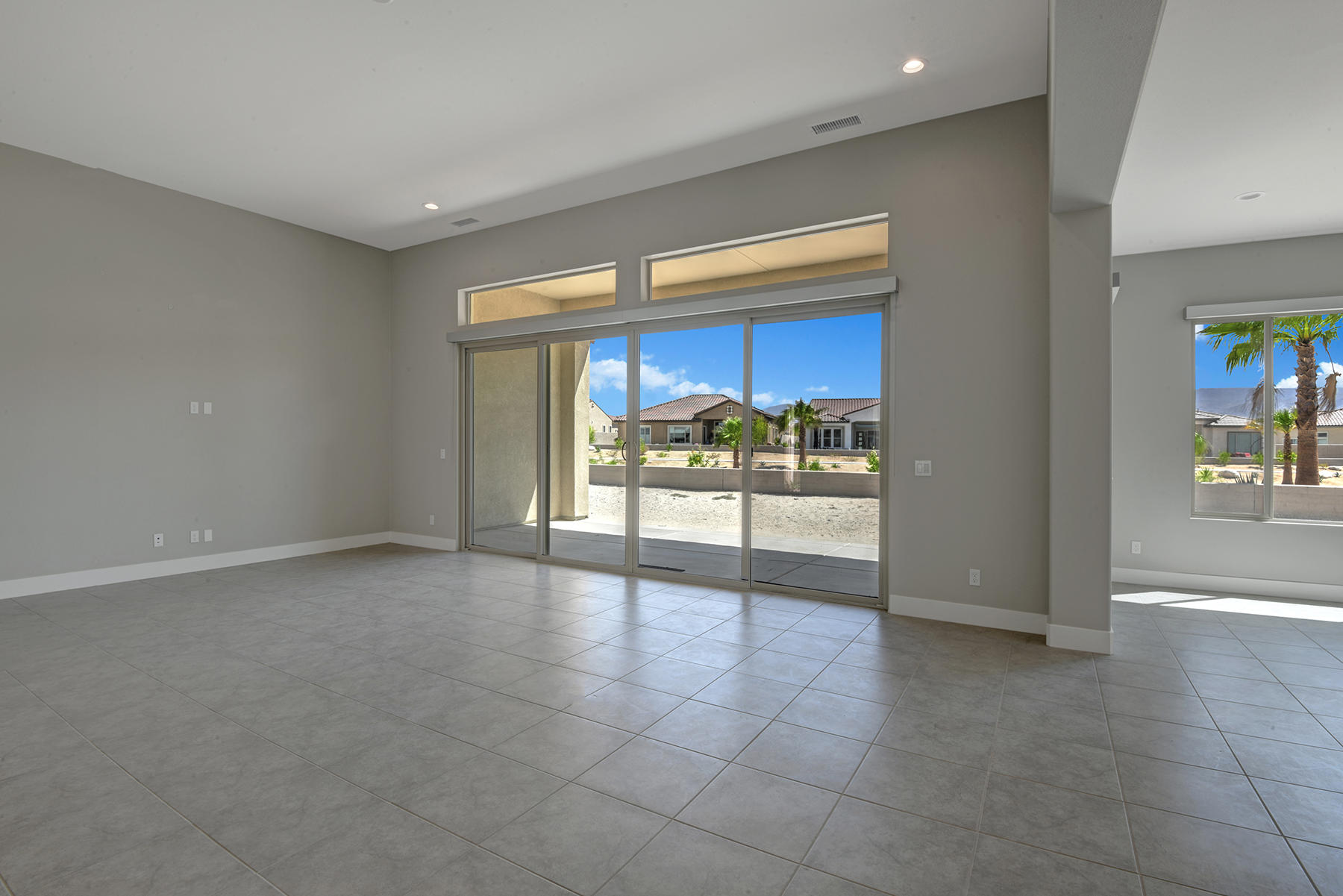 52 Cork Tree Rancho Mirage, CA 92270 - Photo 12 of 47 LIVING ROOM AND DINING ROOM TO BACK YARD