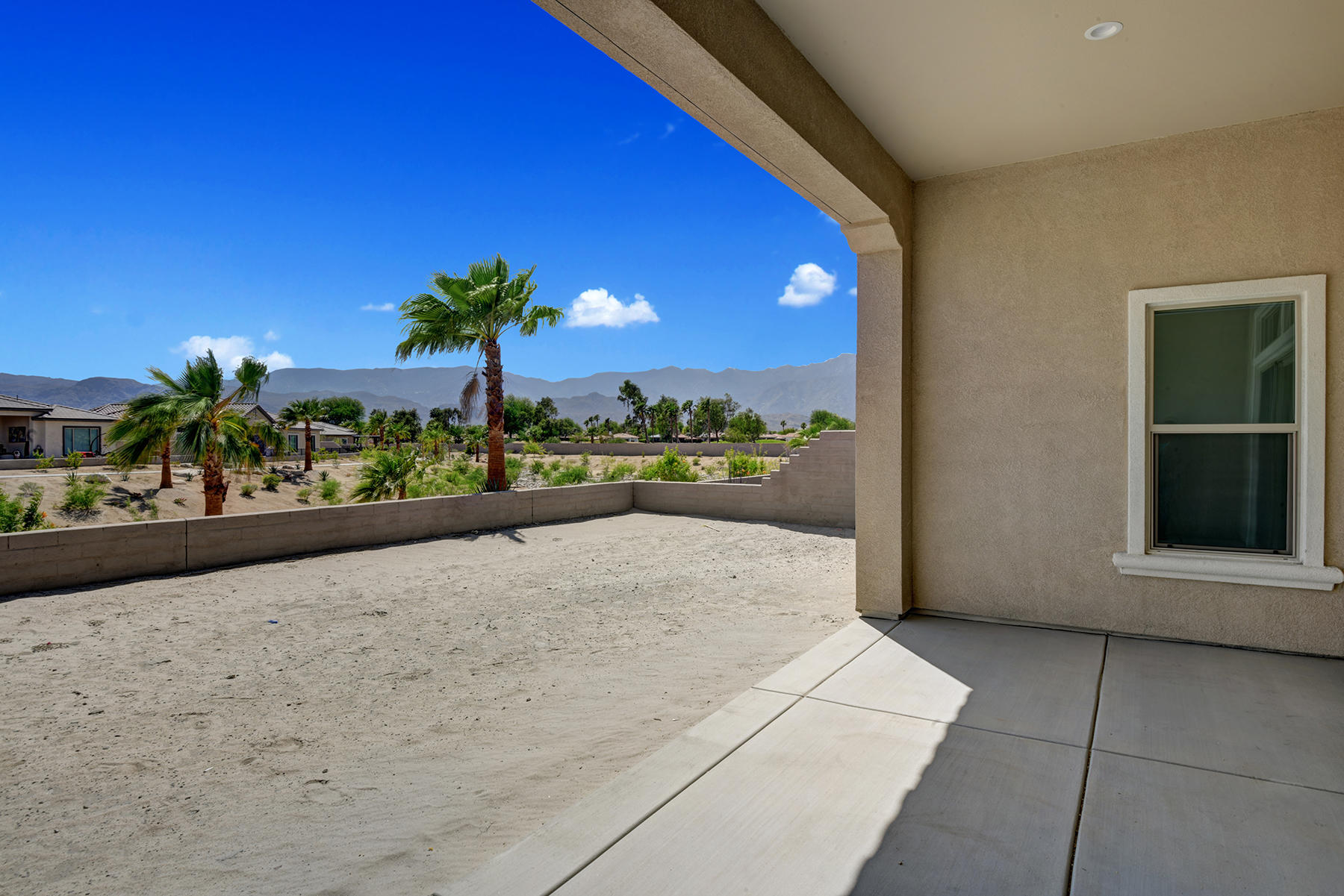 52 Cork Tree Rancho Mirage, CA 92270 - Photo 5 of 47 BACK COVERED PATIO TO YARD AND MOUNTAIN
