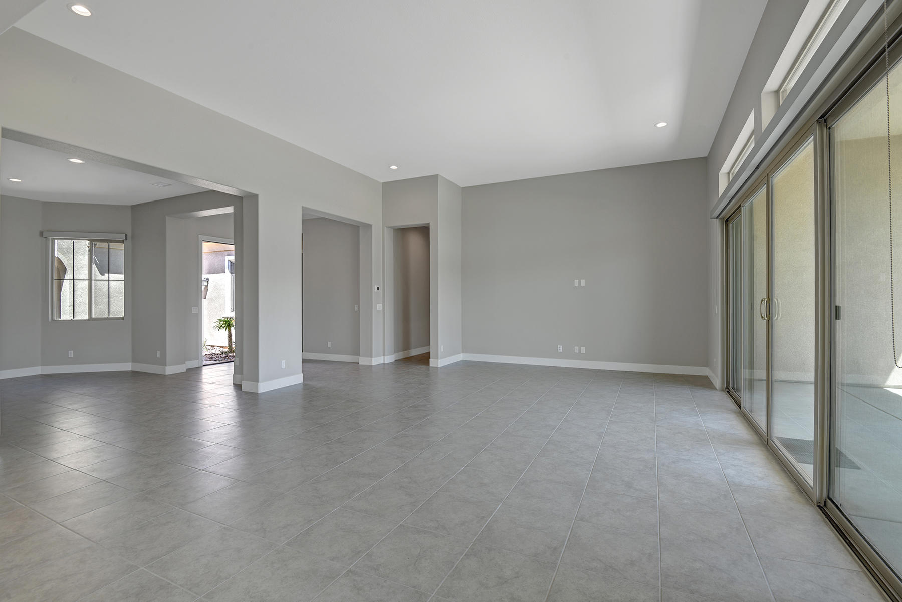 52 Cork Tree Rancho Mirage, CA 92270 - Photo 10 of 47 LIVING ROOM ANGLED TO DINING ROOM AND EN