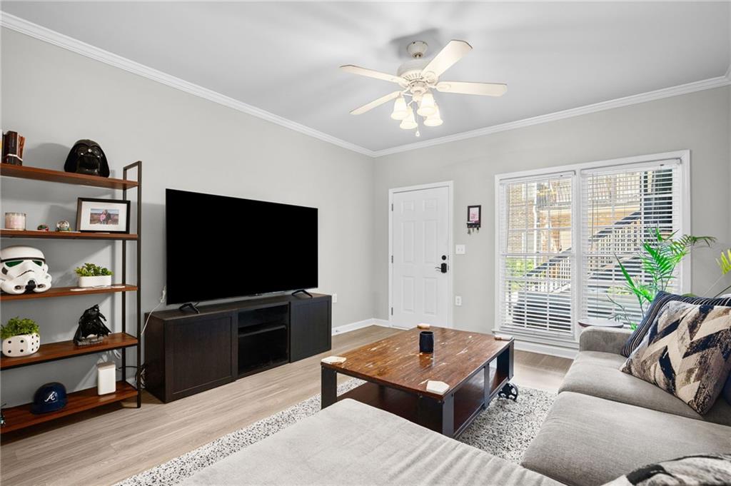 3675 Peachtree Road Northeast, Unit 45 Atlanta, GA 30319 - Photo 29 of 42 a living room with furniture and a flat screen tv