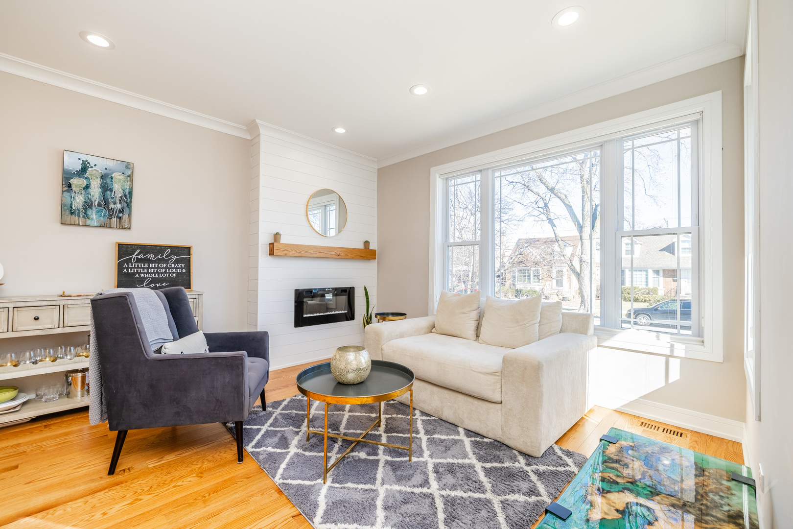 5739 West Grover Street Chicago, IL 60630 - Photo 2 of 38 a living room with furniture a rug and a fireplace