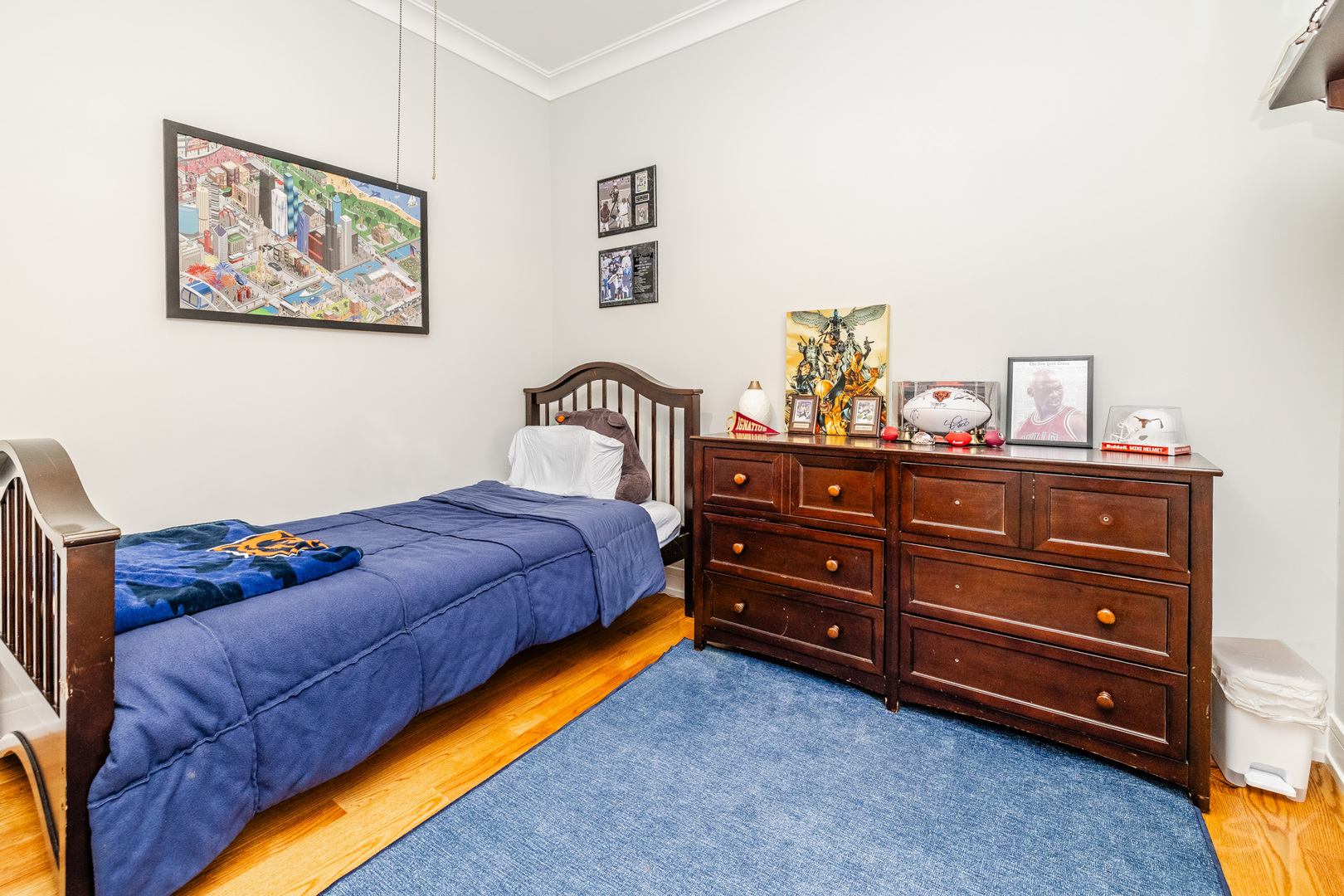 5739 West Grover Street Chicago, IL 60630 - Photo 24 of 38 a bedroom with a bed and painting on the wall