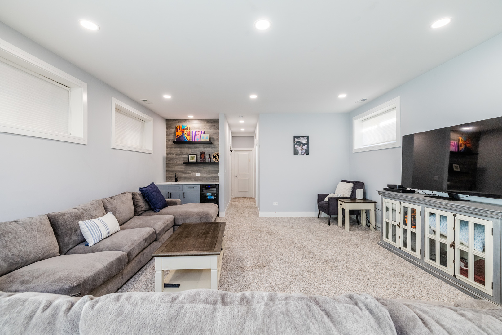 5739 West Grover Street Chicago, IL 60630 - Photo 27 of 38 a living room with furniture and a flat screen tv