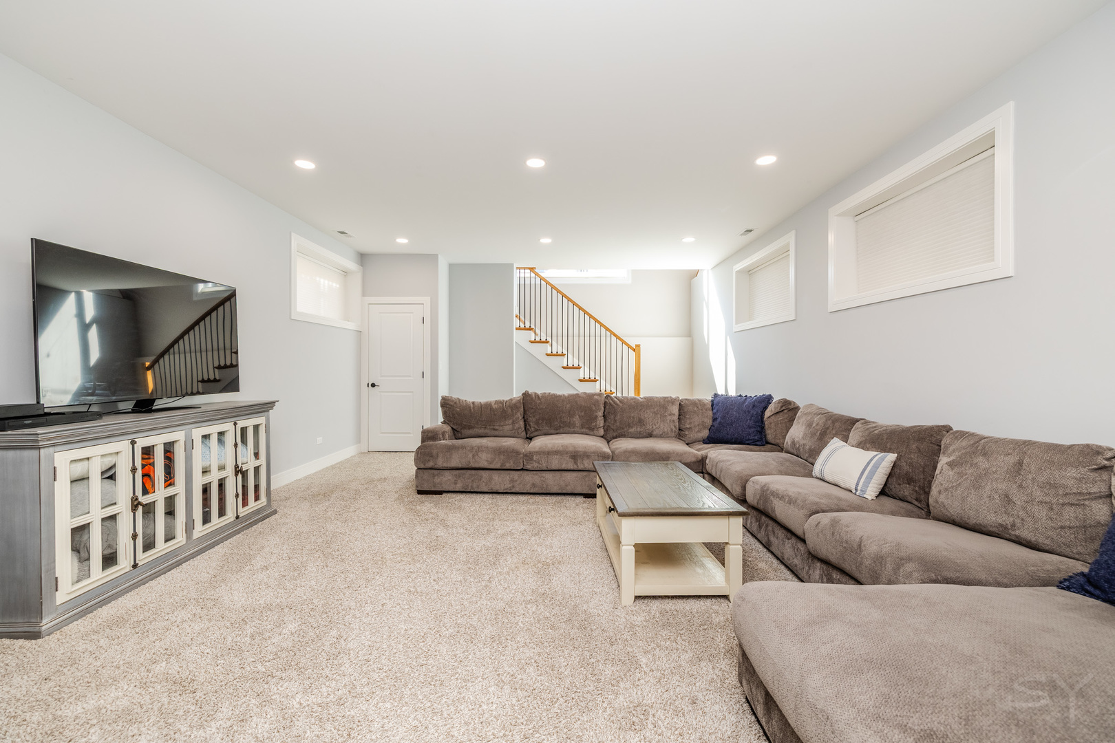 5739 West Grover Street Chicago, IL 60630 - Photo 28 of 38 a living room with furniture and a flat screen tv