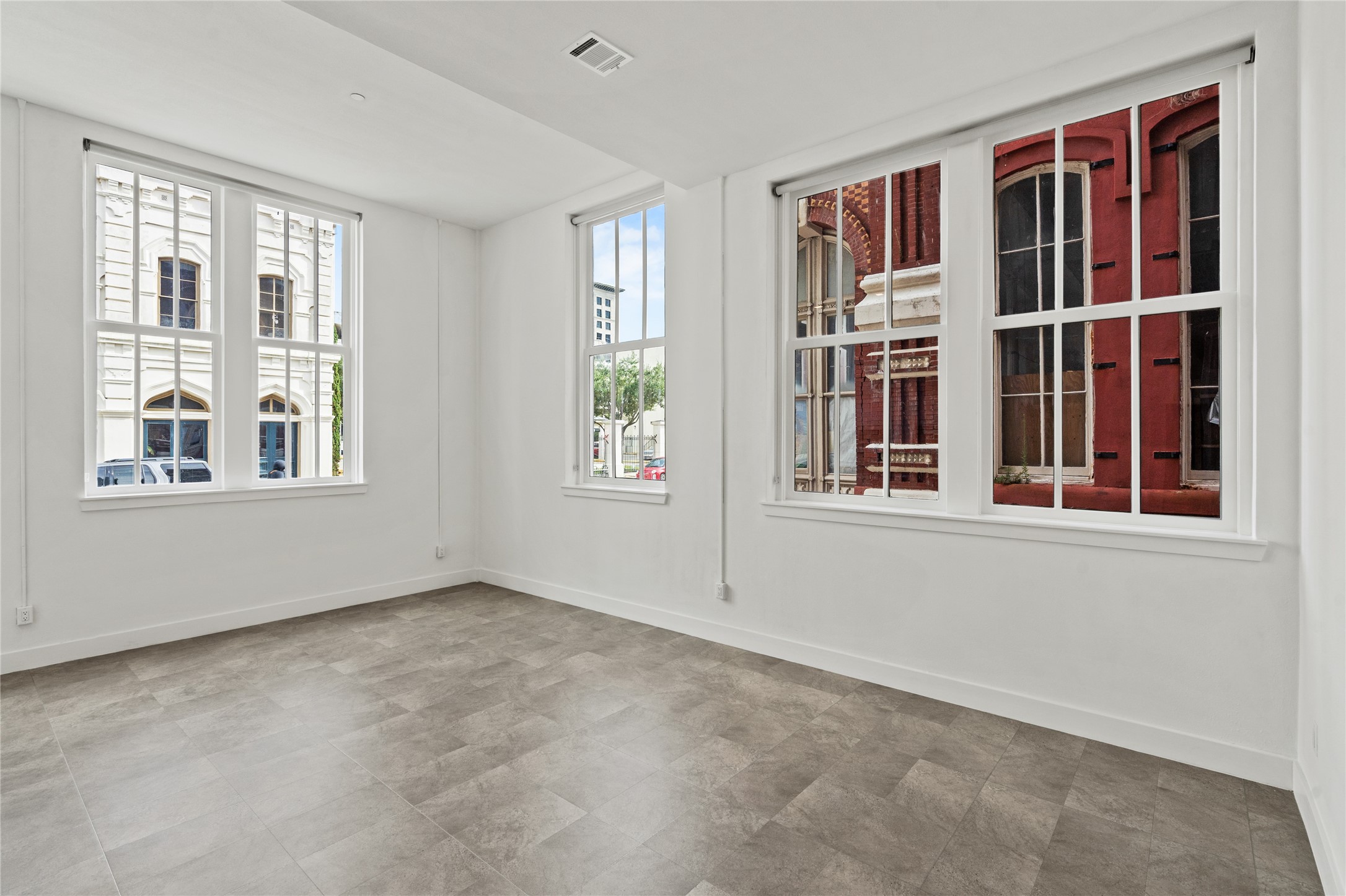 2102 Mechanic Street, Unit 101 Galveston, TX 77550 - Photo 17 of 28 a view of an empty room with a window