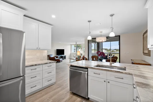 a view of a city from a dining room with furniture window and wooden floor