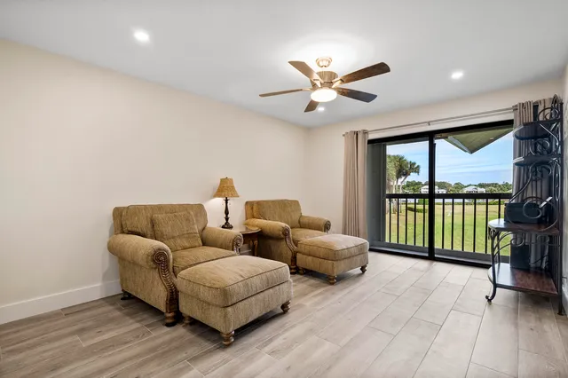 a bedroom with a bed and large window