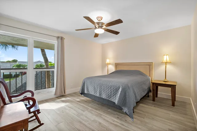 a bedroom with a bed and a table