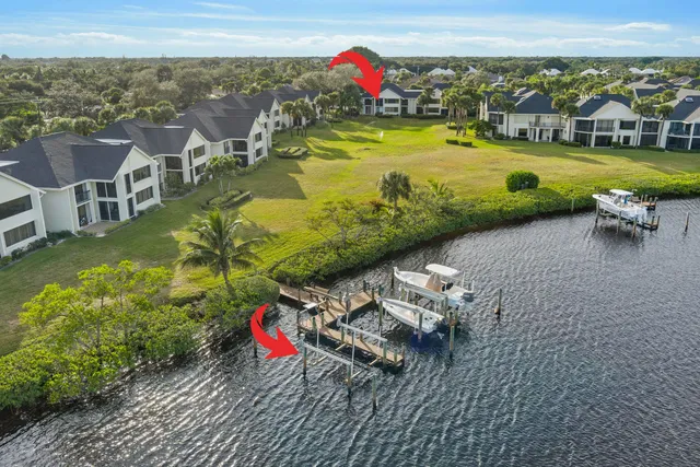 an aerial view of a house with a ocean view