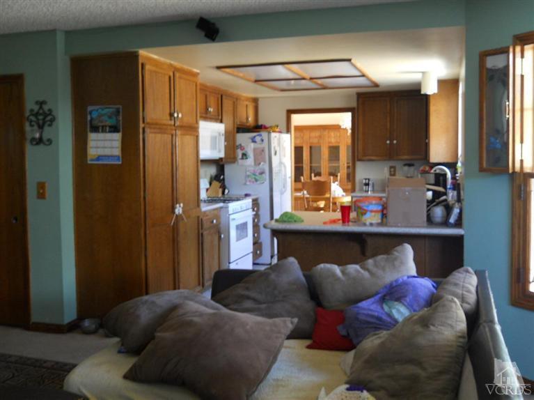 1740 Rivas Lane Oxnard, CA 93035 - Photo 12 of 30 a living room with furniture and a large mirror