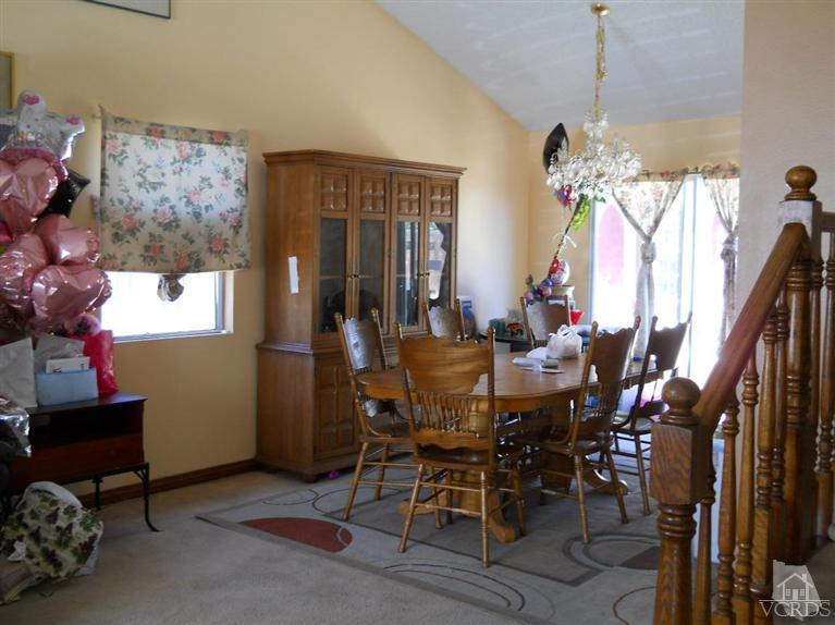 1740 Rivas Lane Oxnard, CA 93035 - Photo 14 of 30 a view of a dining room with furniture and chandelier