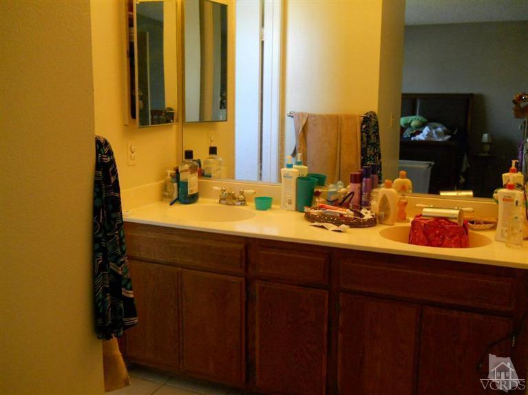 1740 Rivas Lane Oxnard, CA 93035 - Photo 18 of 30 a bathroom with a sink and a mirror