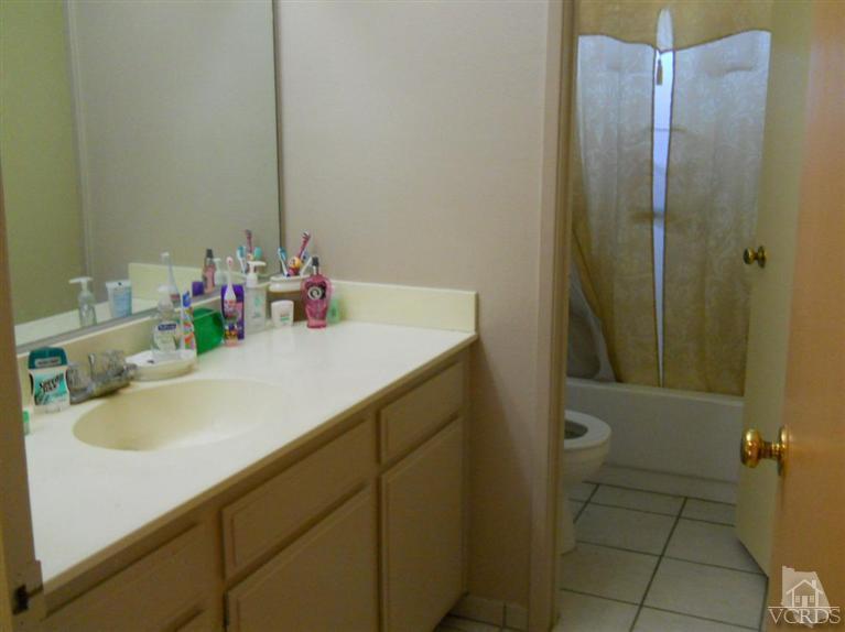 1740 Rivas Lane Oxnard, CA 93035 - Photo 20 of 30 a bathroom with a sink vanity and toilet