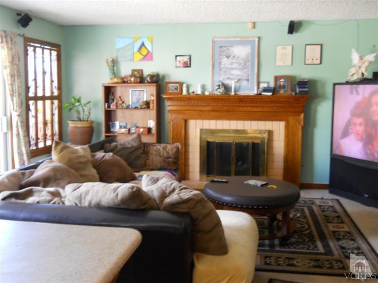1740 Rivas Lane Oxnard, CA 93035 - Photo 3 of 30 a living room with furniture and a fireplace