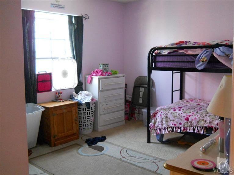 1740 Rivas Lane Oxnard, CA 93035 - Photo 21 of 30 a bedroom with a bed and a window