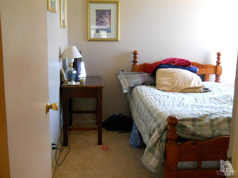 1740 Rivas Lane Oxnard, CA 93035 - Photo 22 of 30 a bedroom with a bed and a table in it